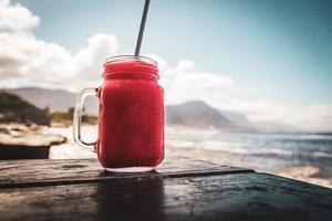 Frozen drink with ocean background photo