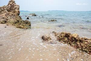 Beach shoreline with rocks photo