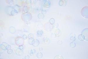 Colorful bubbles on white background photo