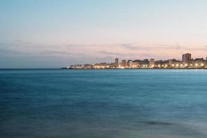 Illuminated coastal town  photo