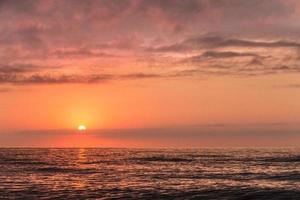 Dramatic ocean sunset photo
