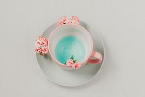 Cup and saucer on neutral background photo
