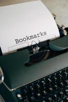 Green typewriter with the word Bookmarks typed out photo