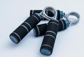 Pair of black and blue exercise hand grips photo