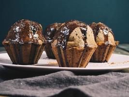 Close-up of plate of chocolate muffins photo