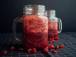 Mason jars filled with cranberry juice 