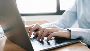 Businesswoman typing on laptop photo