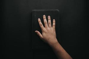 Hand touching book photo