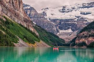 Red boat In lake in Banff National Park photo