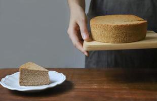 Person holding chiffon cake photo