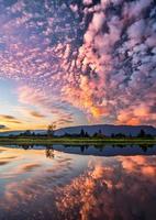 Cloud covered landscape at sunset photo