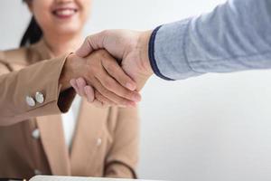 Two business people shaking hands photo