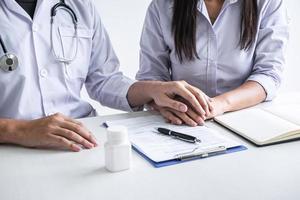 Doctor holding patient's hand photo