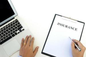 Professional working on an insurance document  photo