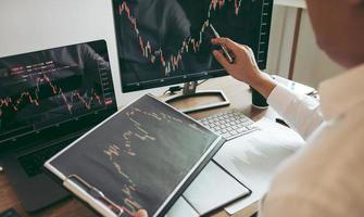 Investor analyzing graphs 