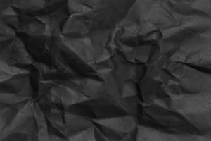 Crumpled black paper texture  photo