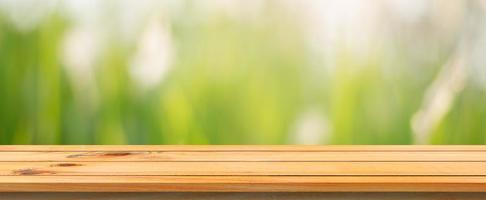 Empty table with blurred grassy background photo