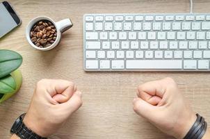 Man is getting angry on his work table photo