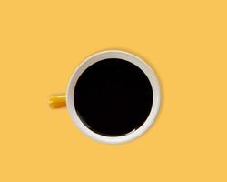 Black coffee in a bright orange cup photo