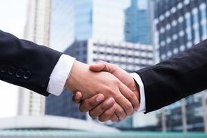 Two businessmen shaking hands photo