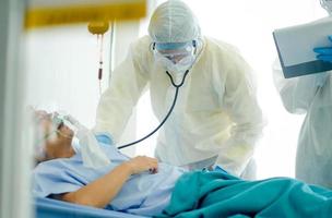 Healthcare staff assisting patient in hospital photo