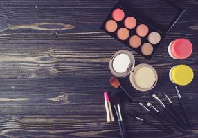 Makeup on wooden surface photo