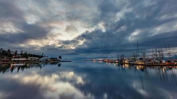 Body of water under cloudy sky photo