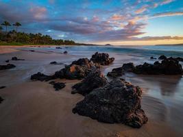 Brown rocks on seashore photo