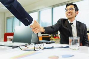 Businessman shaking hands photo