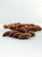 Almonds on white surface photo