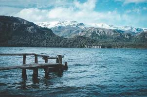 Brown wooden dock on body of water photo