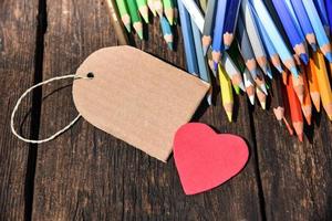 Colored pencils with heart and label photo