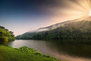 Scenic view of mountain range at sunrise photo