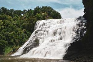 Waterfalls near green trees  photo