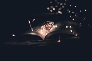 Open book with string lights photo