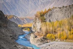 Hunza River flowing through Karakoram Mountain range. photo