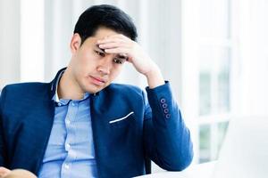 Stressed businessman in the office  photo