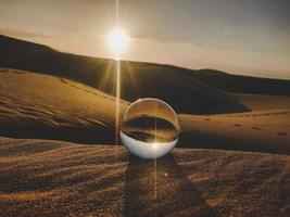 Crystal ball in desert photo