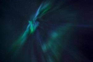 Aurora borealis lights in night sky photo
