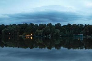 Green trees near body of water photo