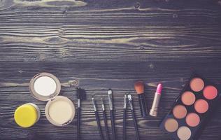 Makeup on wooden table photo