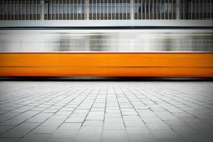 Blurred image of fast moving tram  photo