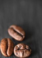 Three roasted coffee beans photo