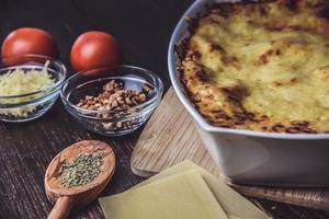 Baked lasagna with ingredients photo