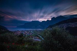 Trees, city and mountain with blurry clouds