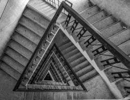 Multi-floor stairs grayscale photo