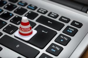 Caution cone on keyboard photo