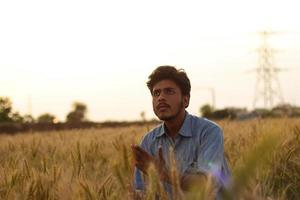 Man in wheat field photo