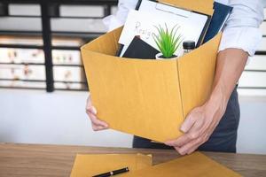 Businessman packing belongings  photo