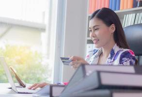 Business woman making online purchase photo